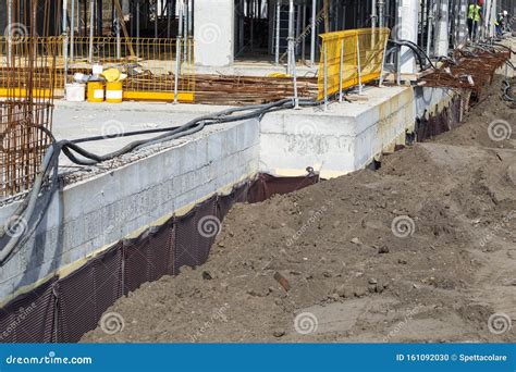 Waterproofing Membrane Applied By Construction Workers On Top Of The Concrete Slab. Editorial ...