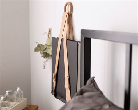 A Leather Wall Mount Hanging Magazine Holder And File Organizer Brings