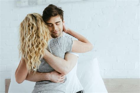 View Of Blonde Girl Hugging With Happy Handsome Boyfriend Stock Photo Image Of Couple