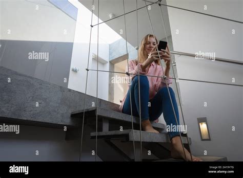 Blonde Woman Sitting On Stairs Hi Res Stock Photography And Images Alamy