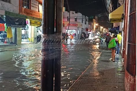 heavy rain  chaos  flooded streets  downtown merida