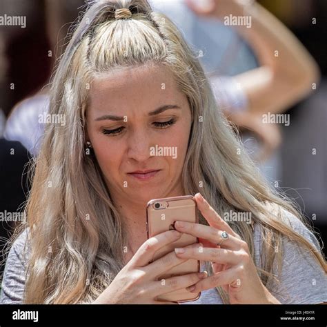 Blonde Woman Texting Stock Photo Alamy