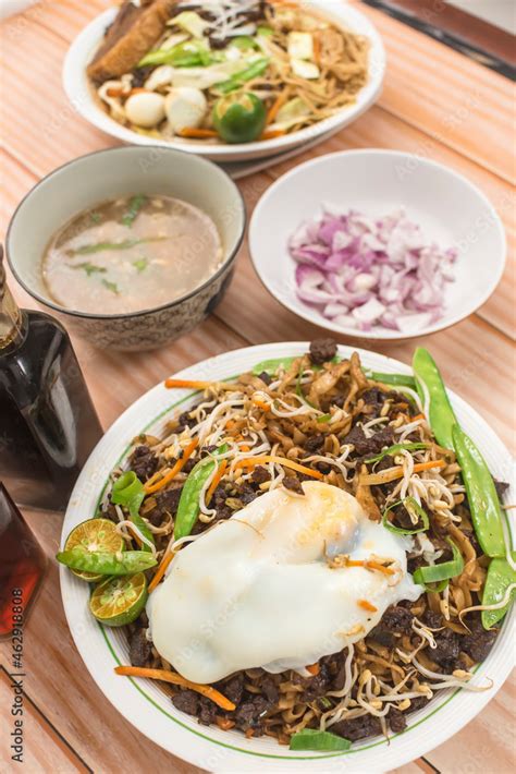 Pancit Cabagan And Pancit Batil Patong With A Side Of Soup And Chopped