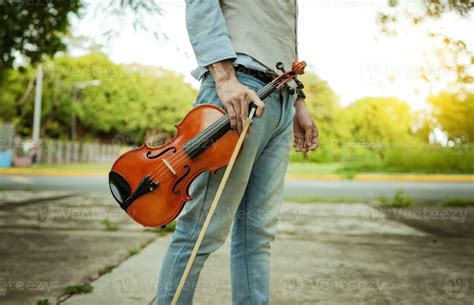 Hands Holding Violin And Hoop Outdoors Close Up Of Hands Holding