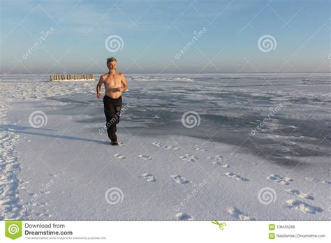 Man With A Naked Torso Running On A Frozen River Stock Photo Image Of Active Conditioning