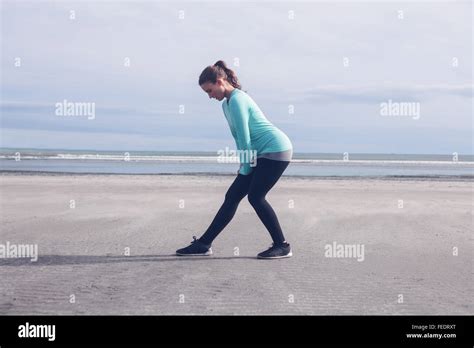 Beautiful Brunette Stretching Her Legs Stock Photo Alamy