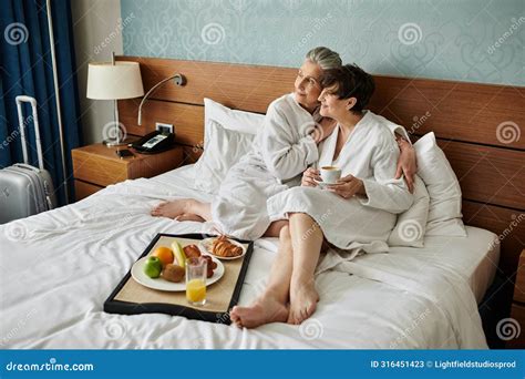 Senior Lesbian Couple Sitting Tenderly On Stock Image Image Of Senior Caress