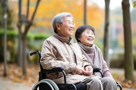 Premium Photo A Man And A Woman Sitting In A Wheel Chair