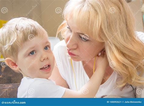 Granny Grandson Both Blonde Kisses Cuddling And Kissing Royalty Free Stock Photo