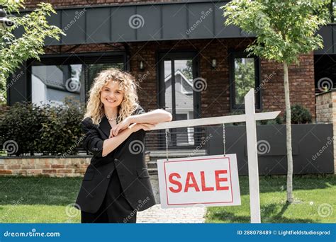 Cheerful Blonde Real Estate Agent Standing Stock Image Image Of Cheerful House