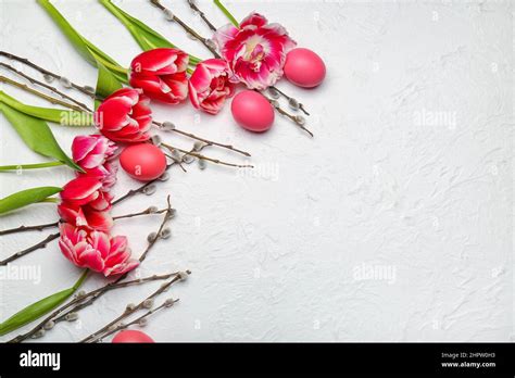Pussy Willow Branches Painted Easter Eggs And Tulip Flowers On Light Background Stock Photo Alamy
