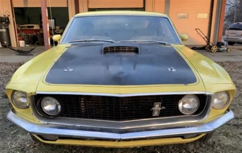 Yellow, black vinyl interior, V-8 351, auto