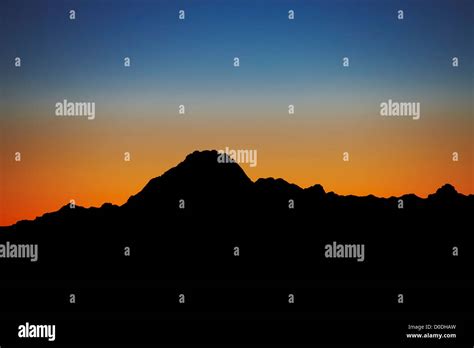 Silhouette of mountain at dusk, western Utah Stock Photo - Alamy