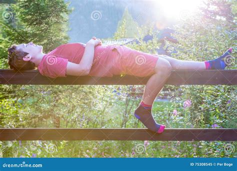 leisure  relaxing outdoors summer evening teenage boy laying