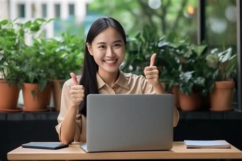 Premium Ai Image Empowered Asian Business Woman Embracing Technology