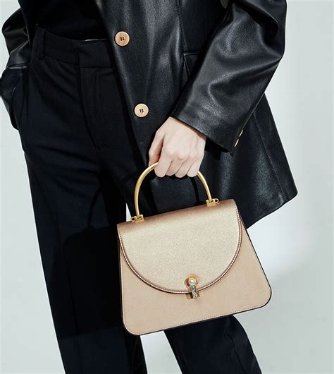 Buy Charles Keith Textured Metal Top Handle Bag Nude In Nude ThStreet Bahrain