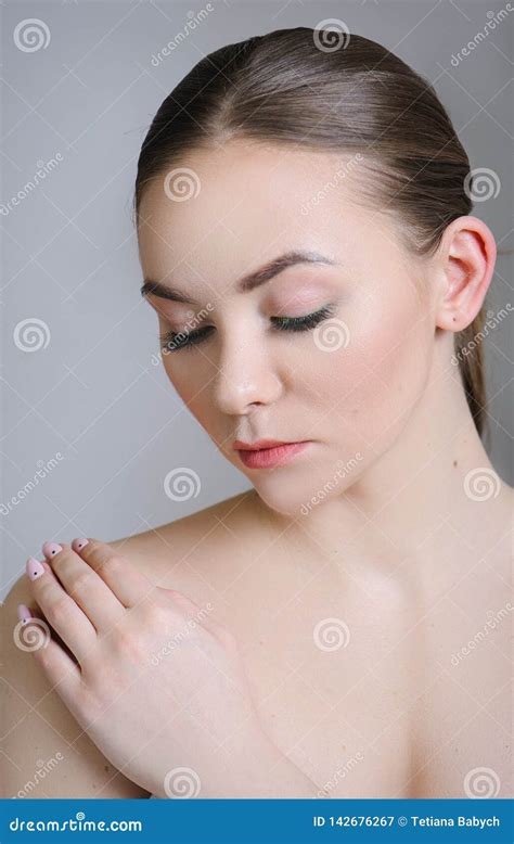 Beautiful Adult Girl Posing With Nude Makeup With Clean Skin And Care Her Skin Stock Image
