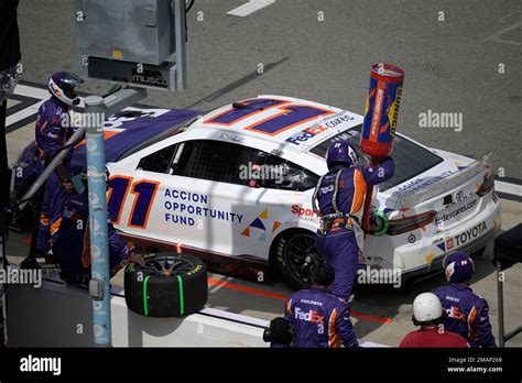 Denny Hamlin Makes A Pit Stop On Pit Road During A Nascar Cup