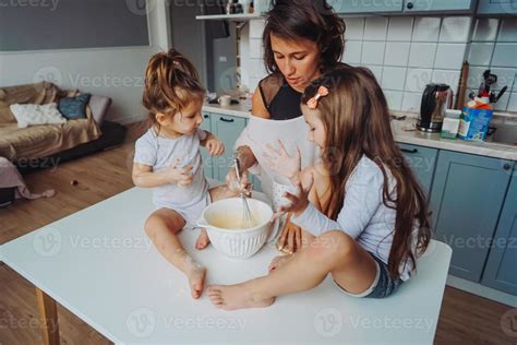 Happy family cook together in the kitchen 11519530 Stock Photo at Vecteezy