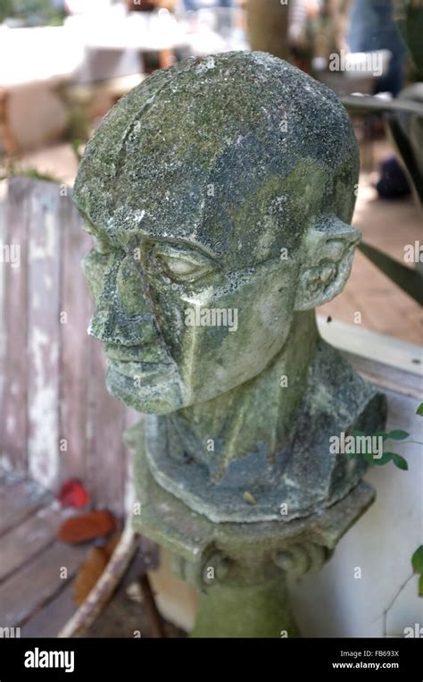 Sculpture Covered With Moss In Garden Stock Photo Alamy