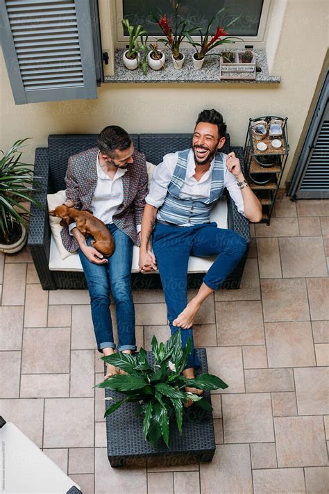 A Gay Couple Relaxing On The Couch View From Above By Stocksy Contributor Michela Ravasio