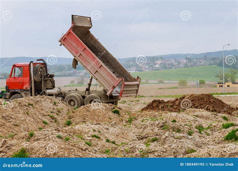 Dump Truck Unloading Soil At Construction Site Stock Image Image Of