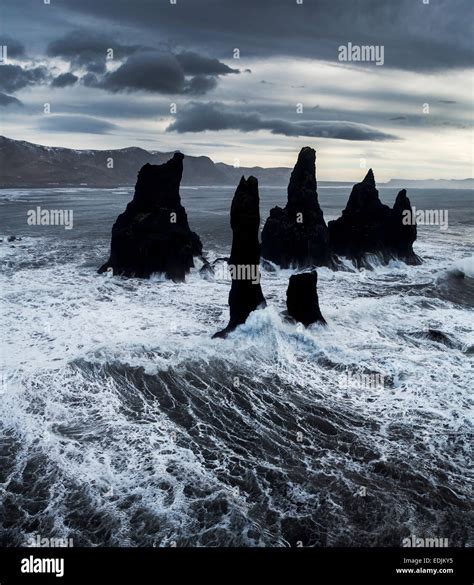 Basalt Sea Stacks And Waves At Reynisfjara Beach Located By Vik In