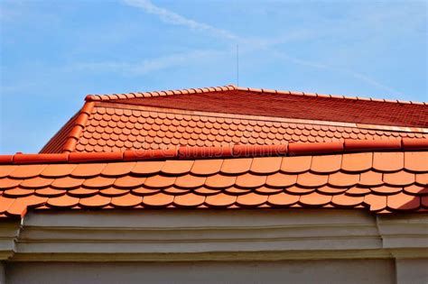 Beavertail Clay Tile Sloped Residential Rooftop White Stucco Elevation