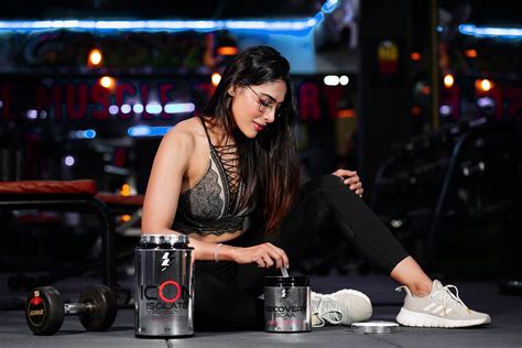 A fitness model preparing her supplements - PixaHive