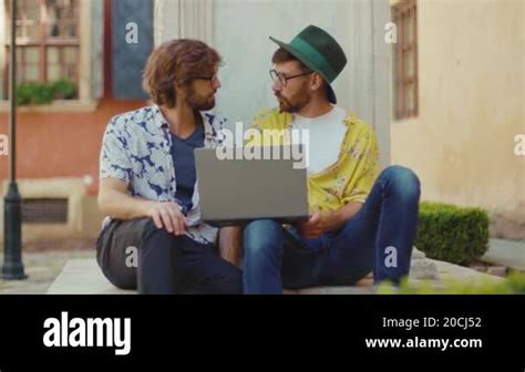 Angry Gay Couple Sitting Quarrels Shouts Outdoors Use Laptop