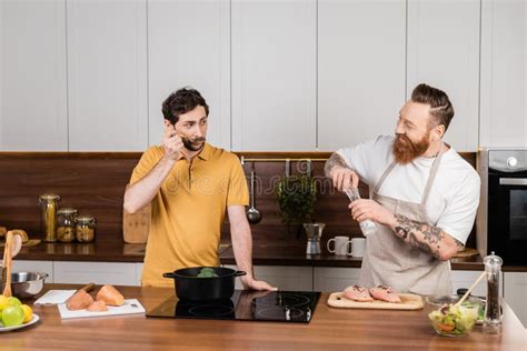 Gay Couple Cooking Vegetables And Chicken Stock Photo Image Of Food