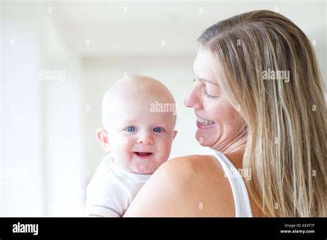 A Happy Smiling Mother And Baby Stock Photo Alamy