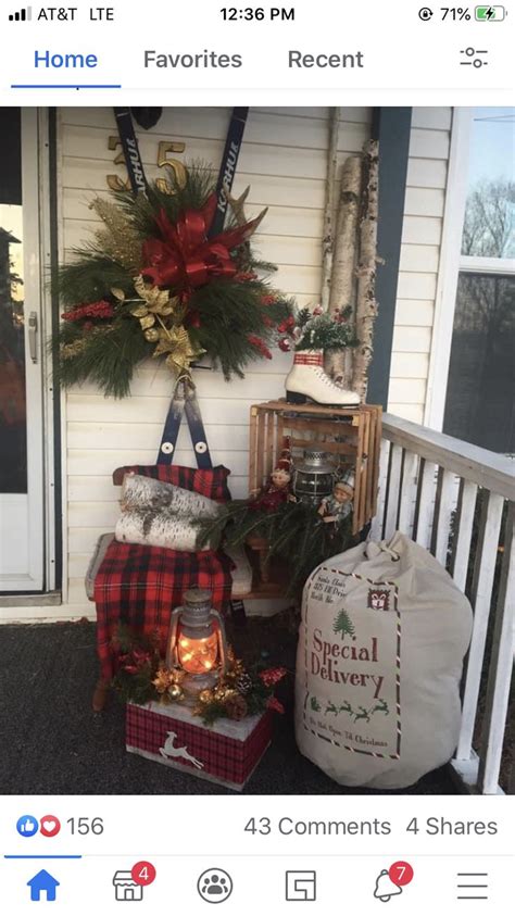 Christmas Decorations On The Front Porch Of A House