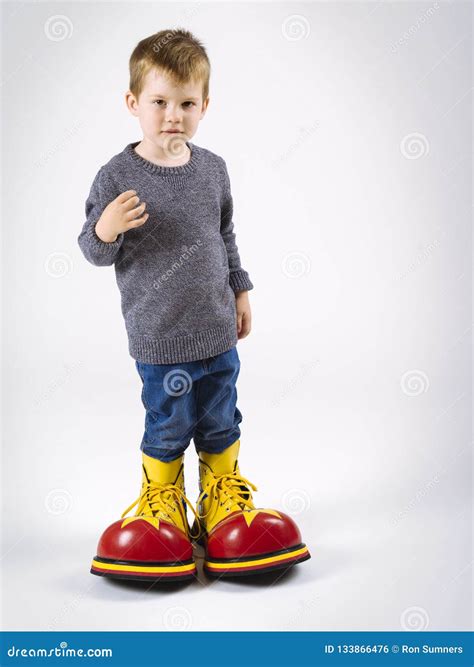 Small Boy with Big Clown Shoes Stock Photo - Image of cute, large: 133866476