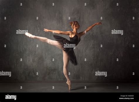 Beautiful Attractive Blonde Woman Primer Ballerina In A Black Dance Pack White Pantyhose And
