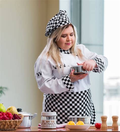 Female Cook Preparing Soup In Brightly Lit Kitchen Stock Photo Image
