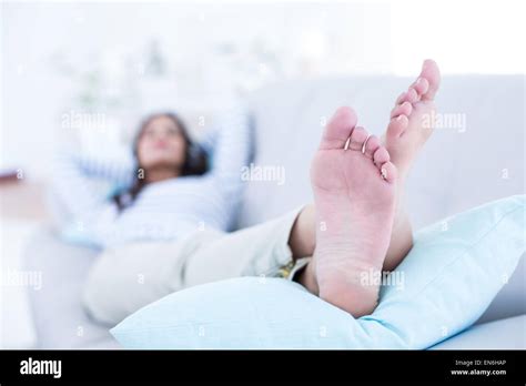 Smiling Beautiful Brunette Relaxing On The Couch Stock Photo Alamy