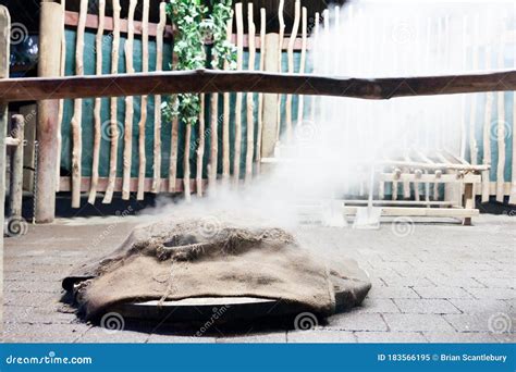 Traditional Hangi Meal Cooked Underground In An Earth Oven By Maori