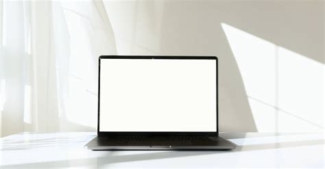 Laptop Computer on White Surface Against White Background · Free Stock