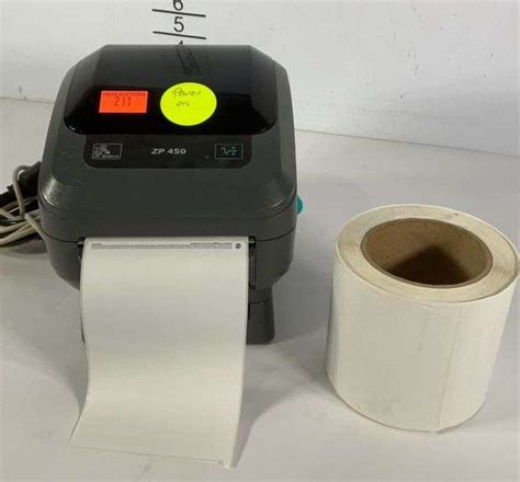 Zebra printer ZP 450 with an extra roll of UPS shipping labels. Powers