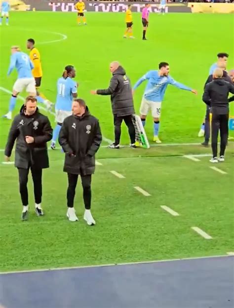Awkward moment: Cherki refuses to leave pitch without Guardiola
