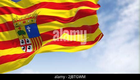 Aragonese flag waving in the wind on a clear day. Aragon is an autonomous community in Spain ...