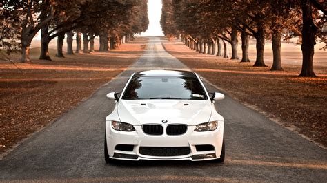 White Bmw Sedan Travelling On Gray Cement Road Surrounded By Trees Hd