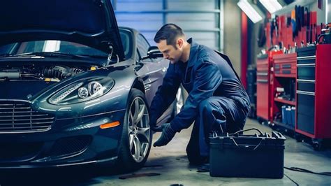 Premium Photo Car Mechanic Changing Wheels In Car