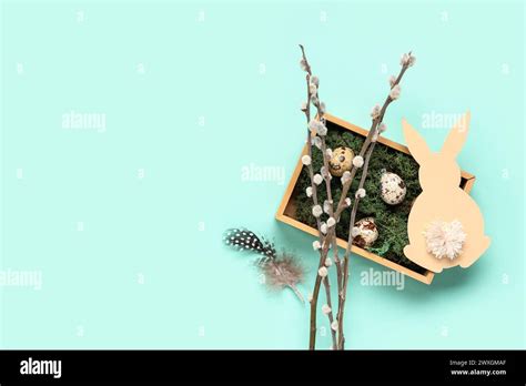 Wooden Box With Easter Eggs Pussy Willow Branches And Paper Bunny On Turquoise Background Stock