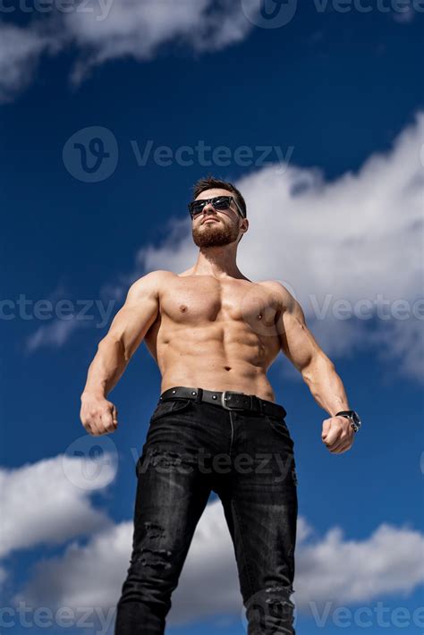 Athletic Strong Bodybuilder With Naked Torso Shirtless Muscular Man Outdoor Posing