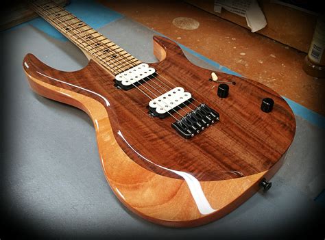 An Electric Guitar Sitting On Top Of A Table