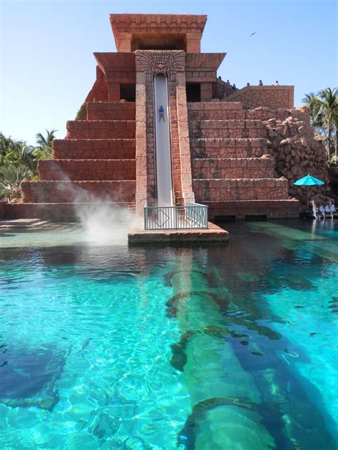 the water is blue and clear with steam coming out of it's back end