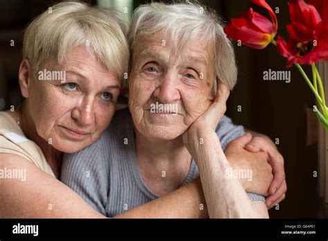 Mature Woman Hugging Her Old Mother Stock Photo Alamy