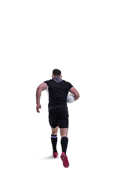 Jugador De Rugby Corriendo Con La Pelota Foto Premium